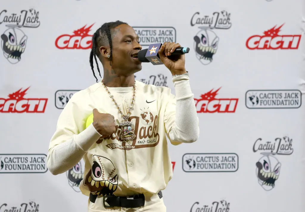 A Cactus Jack Foundation event, with Cacti branding on the wall behind