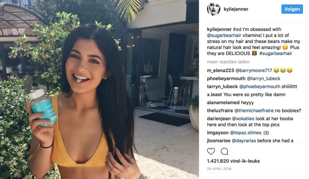 Kylie Jenner's sponsored Instagram post holding the SugarBearHair bottle, captioned #ad.