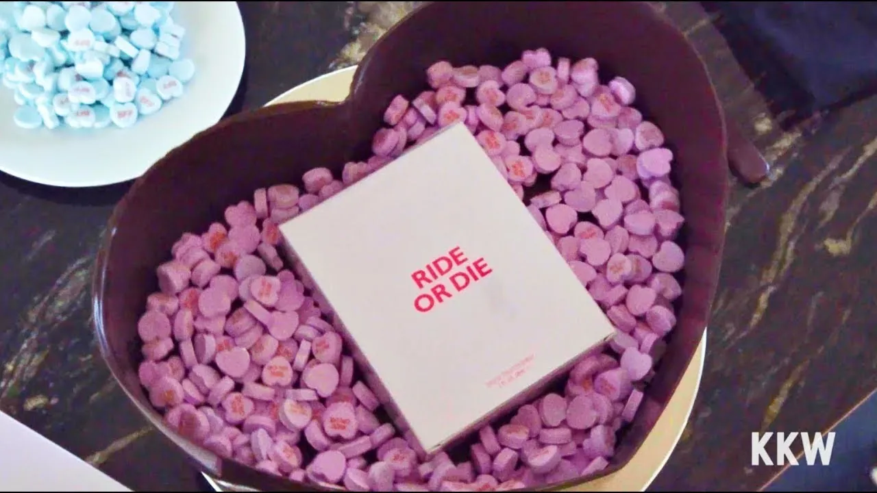The Ride or Die box sitting on lilac candy hearts inside the chocolate shell, from KKW's own video with the chef who made them