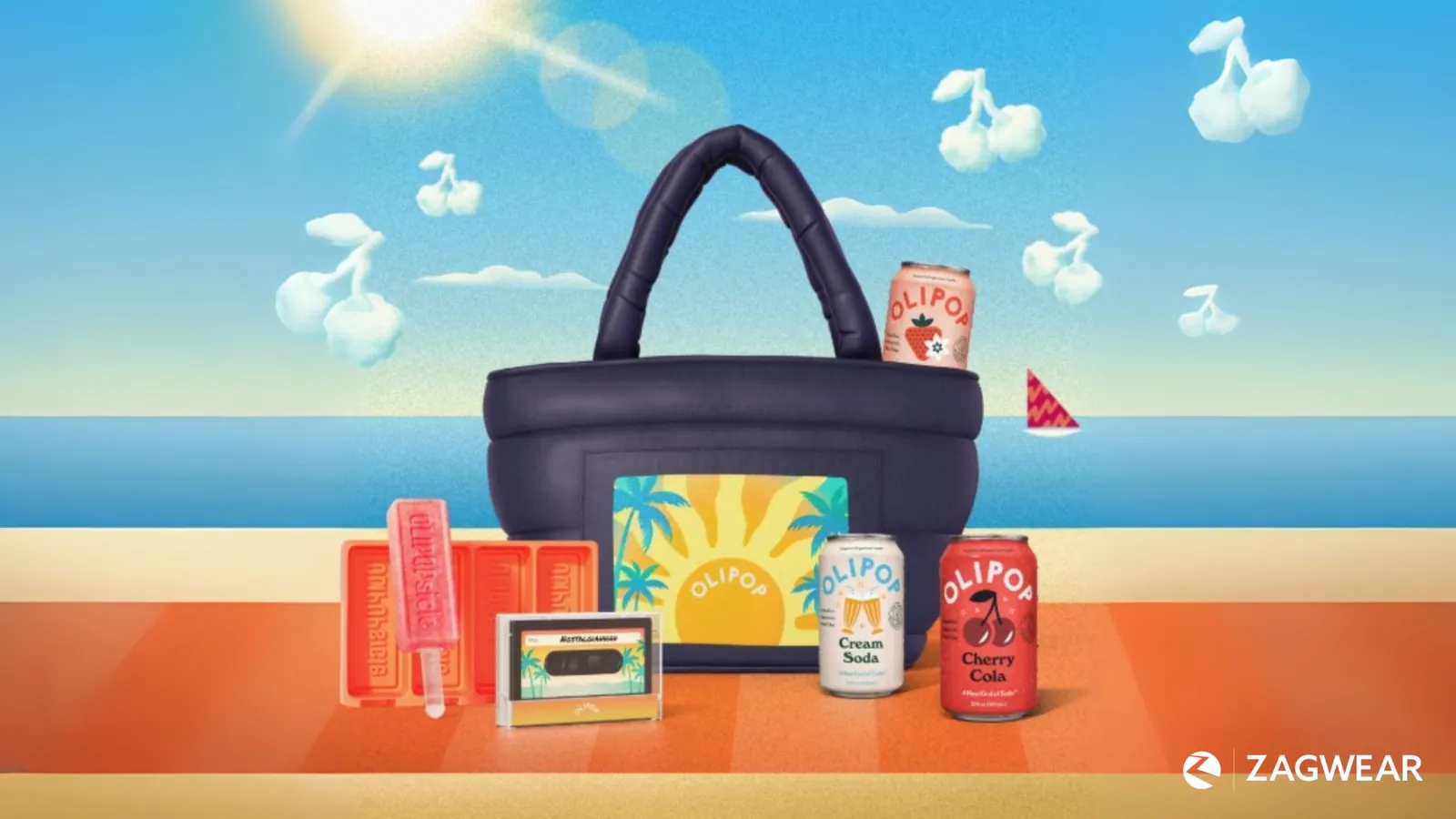 Olipop's summer box laid out on a beach, a navy puffer tote, three cans, an ice pop mold and a speaker shaped like a cassette tape