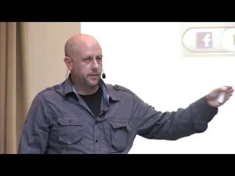 A speaker presenting on stage