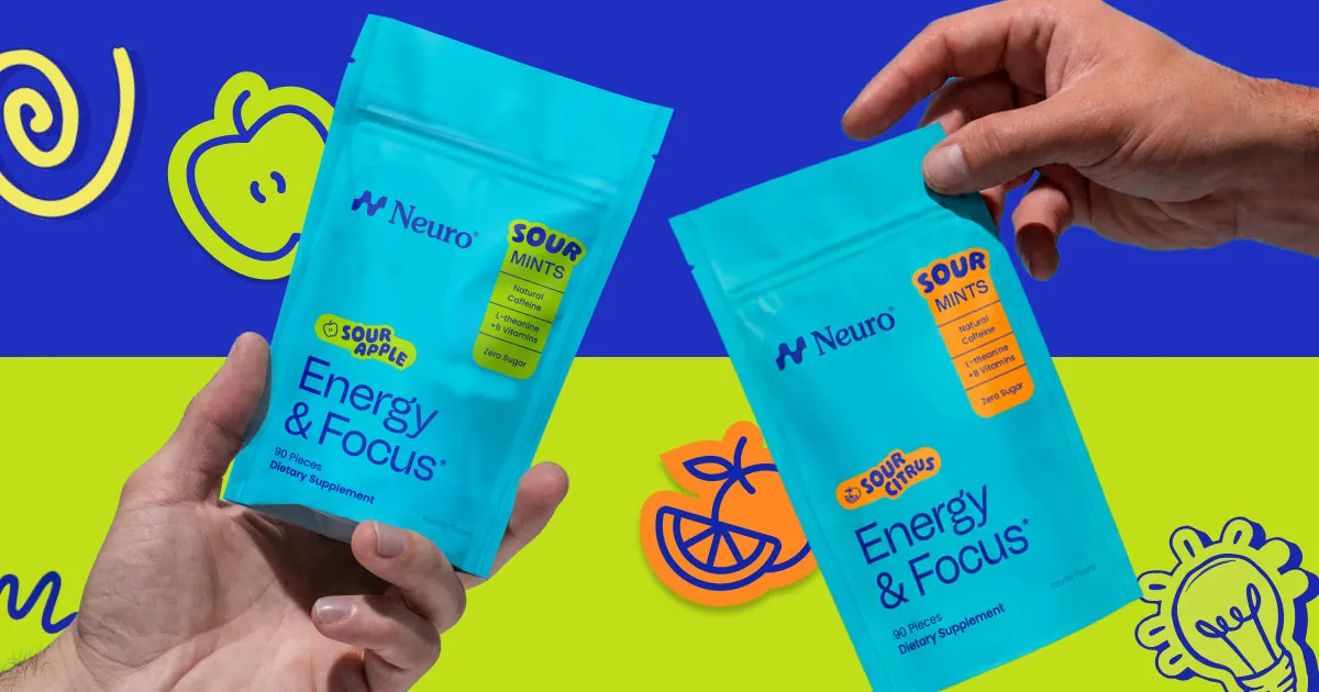 Two hands holding packs of Neuro energy and focus gum