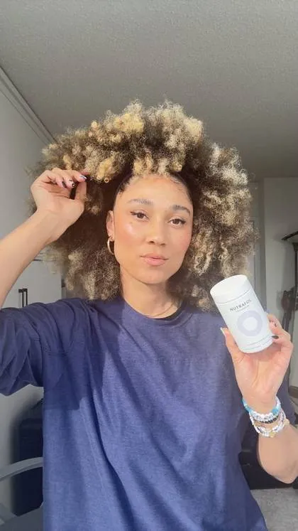 @allymisslove's paid Instagram post for Nutrafol, the product in hand