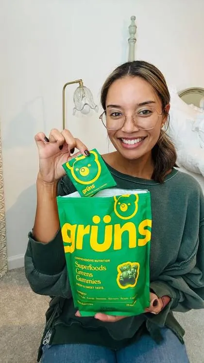 a creator with the Grüns bag she was sent, in her paid post