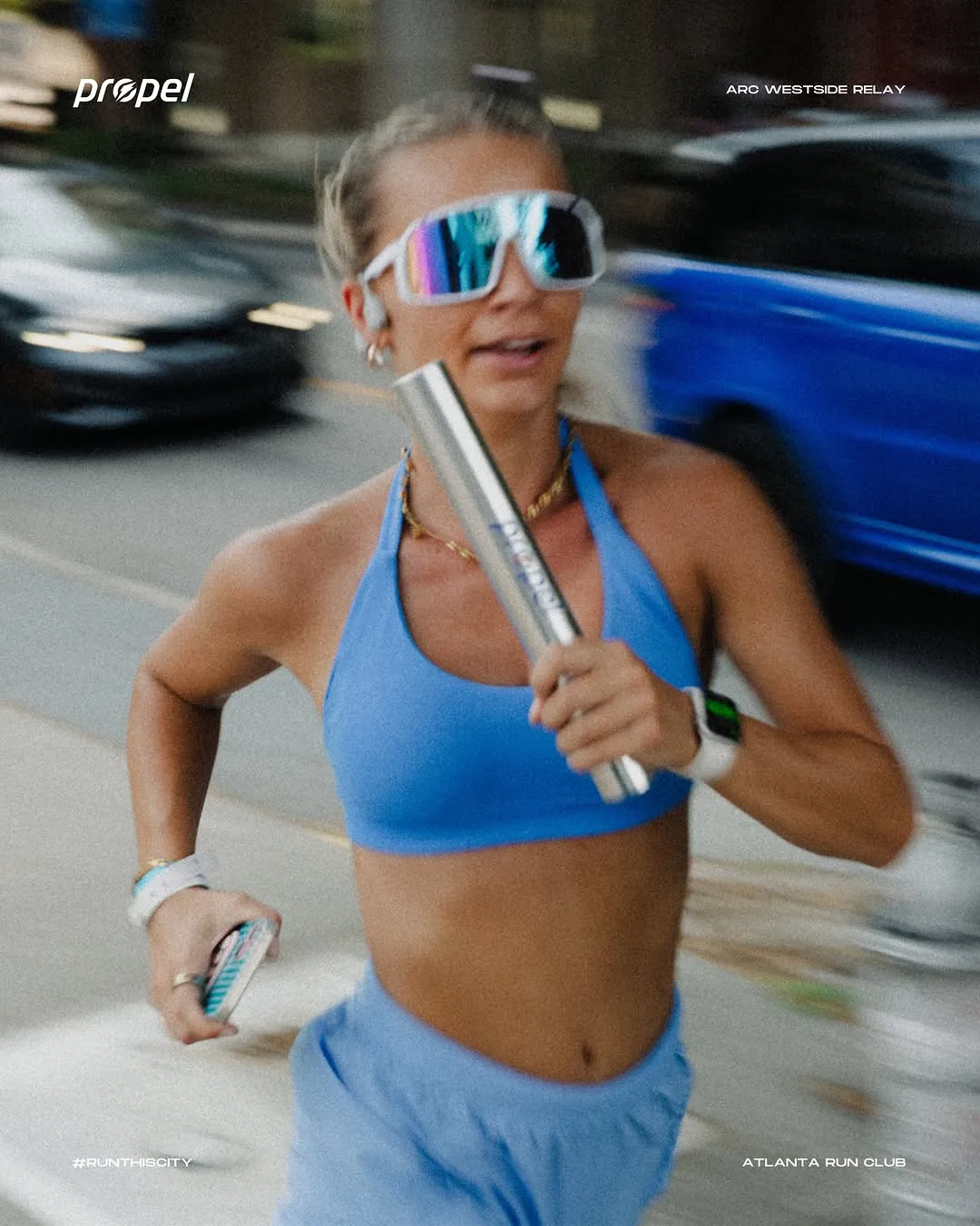A runner drinking mid run