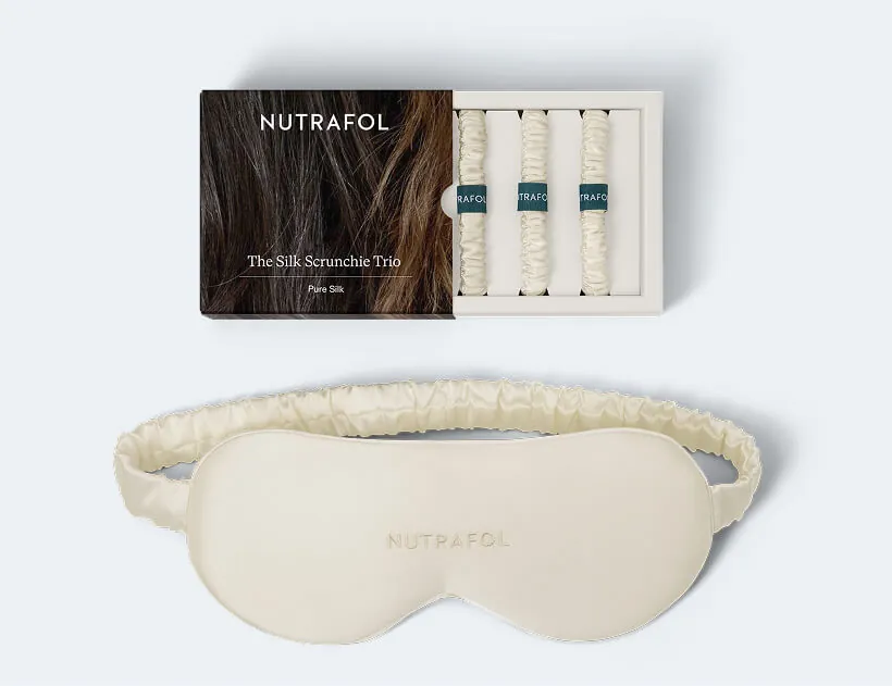 Nutrafol's own open Silk Scrunchie Trio gift box, three silk scrunchies and a matching eye mask, all branded Nutrafol