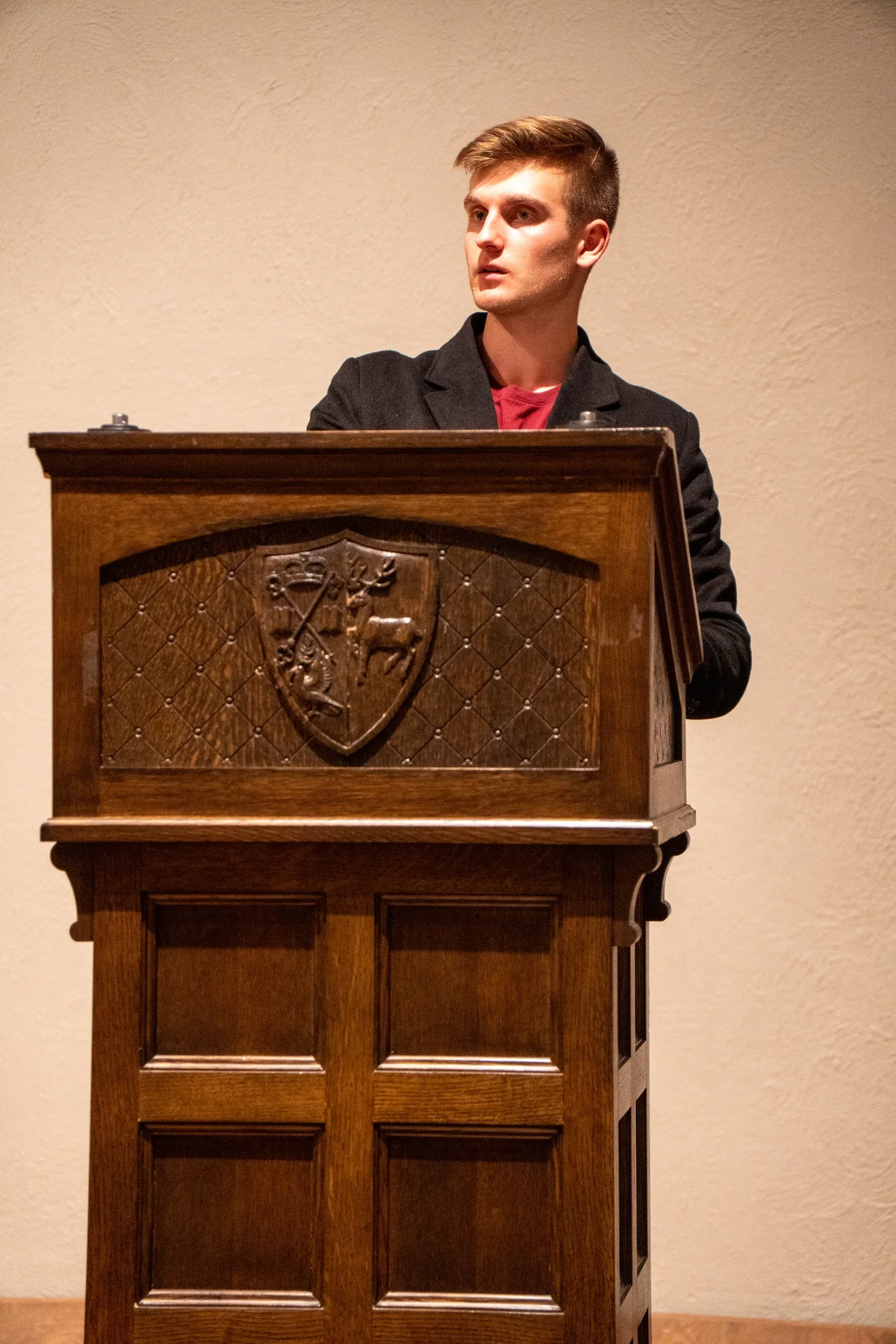 Speaking at the lectern.