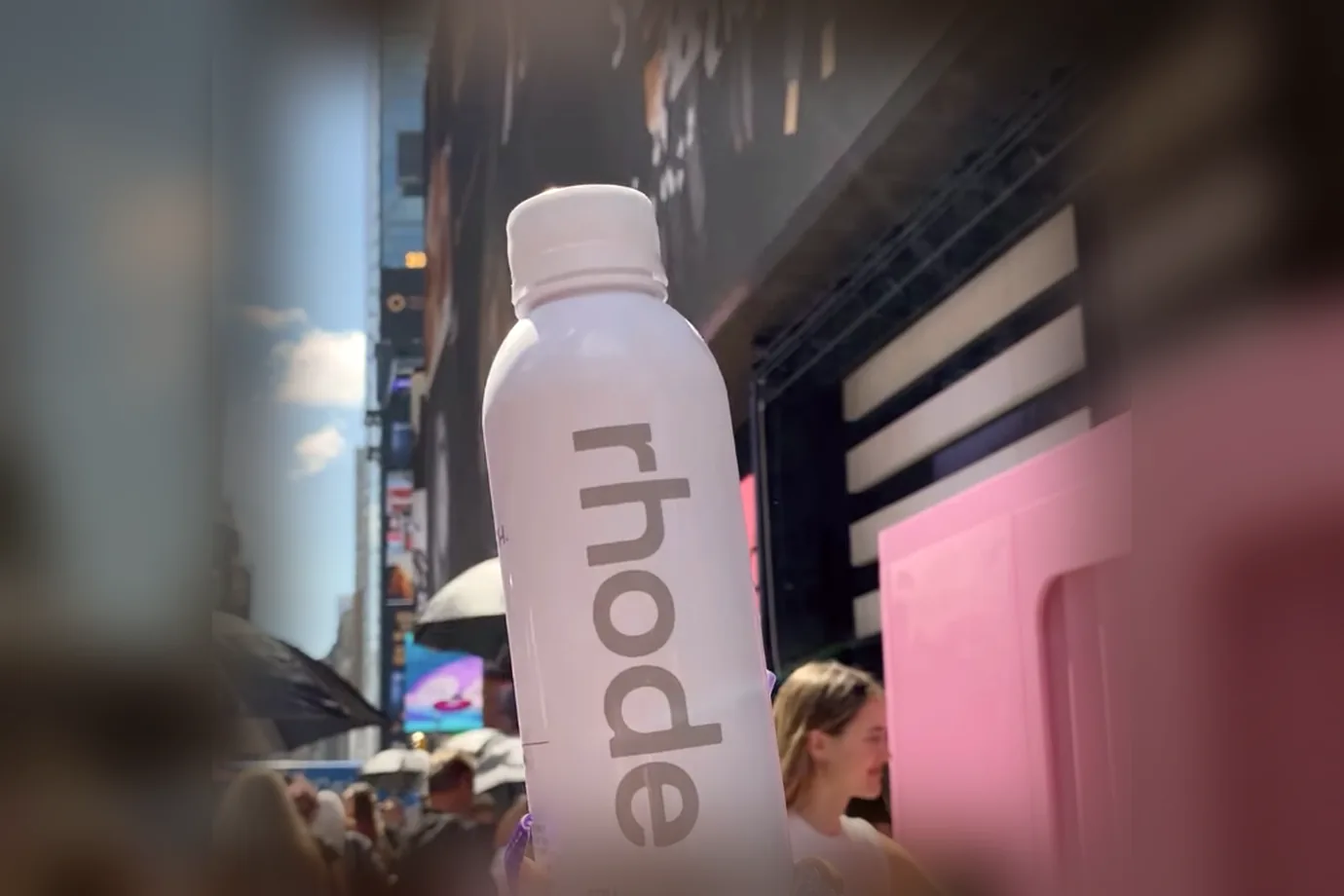 A Rhode bottle held up outside the Sephora launch