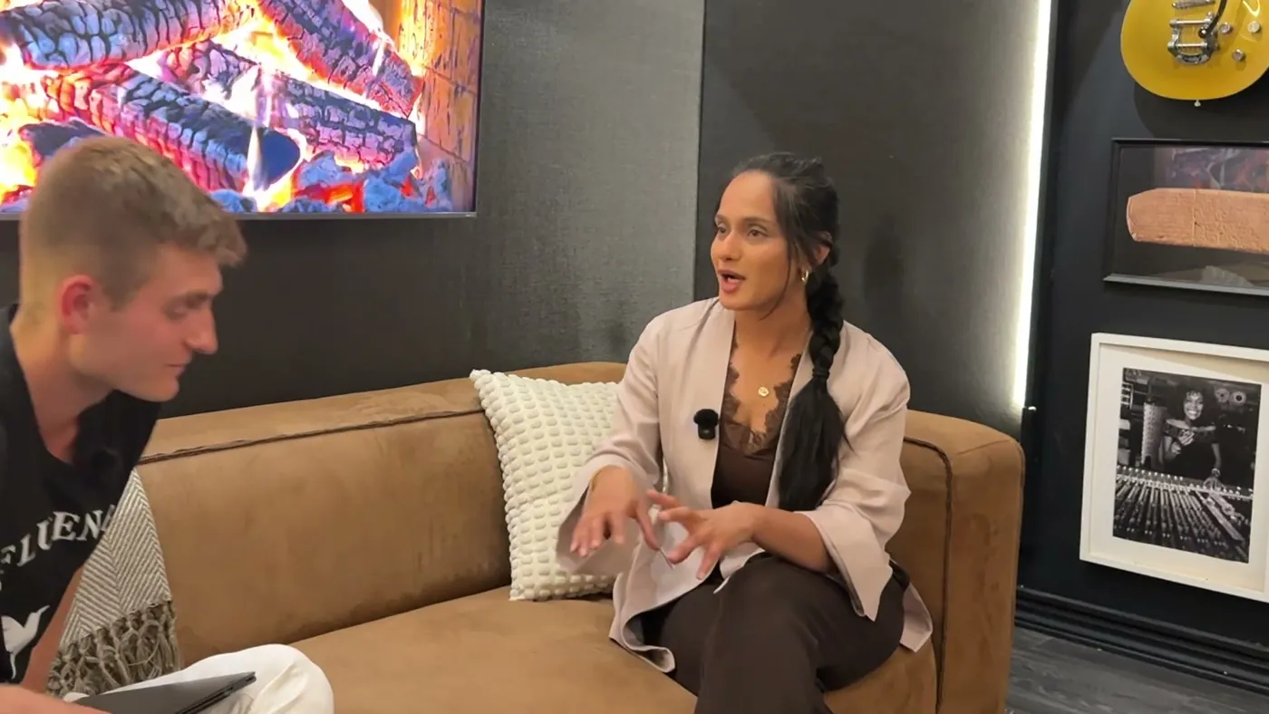 Recording an episode on the couch, both people mid conversation