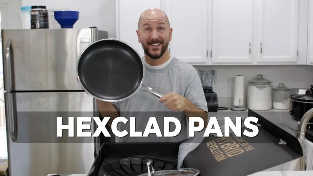 A creator holding a HexClad pan over its open shipping box
