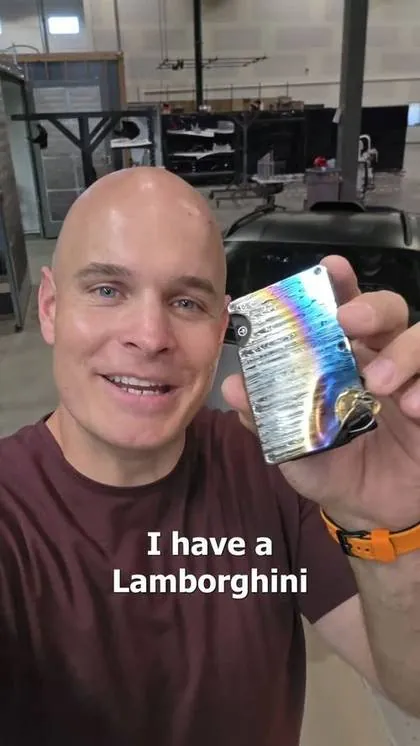 A creator holding a Ridge wallet in his own video